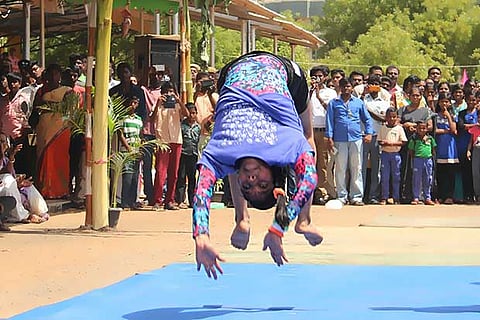 A student performing gymnastics in Madurai