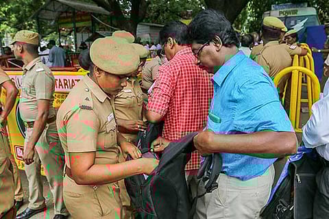 Visitors to the Assembly being scanned by cops (Photo: Justin George)