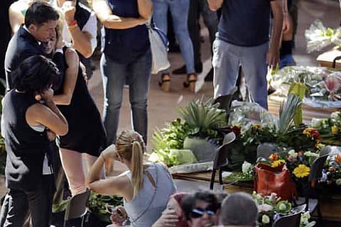 Italy buries quake dead, recalls sisters embracing in rubble