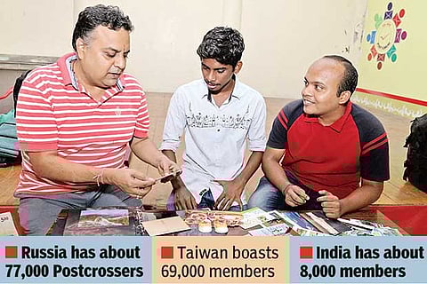 Enthusiastic Postcrossers display their collection of post cards (Photo: Prakaash)