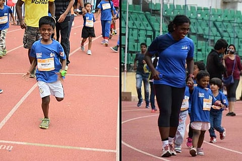 Cheerful Kids participating with their parents at a recently organised marathon in the city