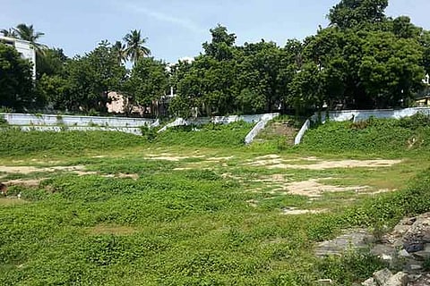 The Kasi Viswanathar Temple tank in Ayanavaram is filled with sand, weeds and rubbles