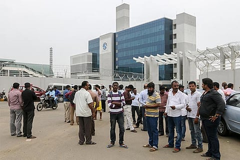 Vendors staging a protest in front of the CMRL headquarters in Chennai