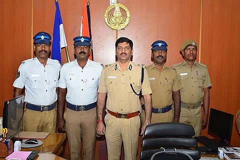 Madurai CoP Shailesh Kumar Yadav at his office along with four police personnel