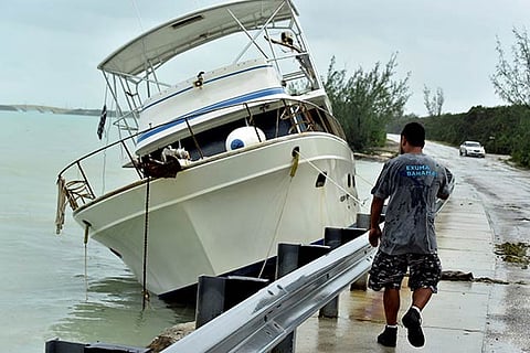 A boat sits washed up along the shore in aftermath of Hurricane Matthew