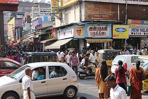 Pedestrians cross the road at many places, confusing motorists and buses