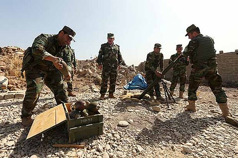 Kurdish forces gather on the outskirts of Mosul during preparations to eliminate the Islamic State