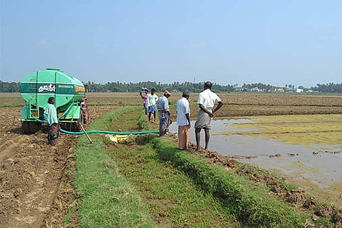 A field being irrigated with the help of a tanker lorry in Thanjavur