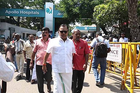Actor Radha Ravi exiting the Apollo Hospitals after visiting the CM