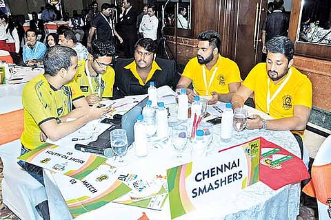 Chennai Smashers owner Vijay Prabhakaran, CEO Kalaiarasan at the Premier Badminton League auction