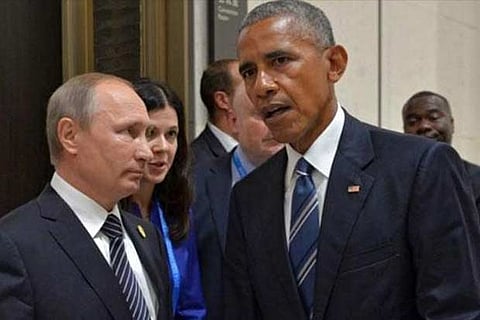 Russian counterpart Vladimir Putin and US President Barack Obama at the APEC summit