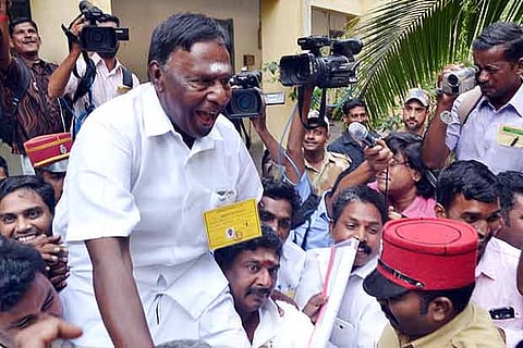 Congress cadre celebrate the win of Chief Minister V Narayanasamy from Nellithope