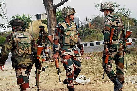 Army personnel take position during encounter after militants attacked an Army camp in Jammu