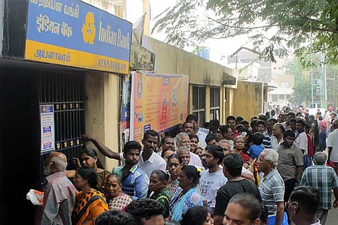 Chennaites throng outside an ATM in the city to withdraw money