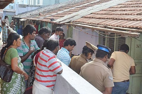 Police officers inspecting the house where the aged woman was found murdered in Coimbatore