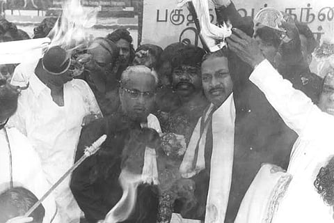 DK president K Veeramani burn copies of the GO issued by MGR regime
