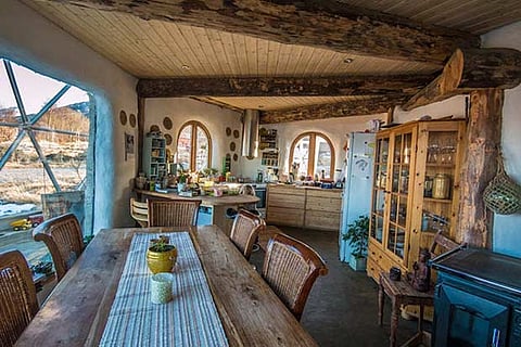 The cozy, rustic interior creates a warm, welcoming environment