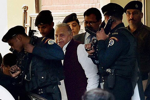Samajwadi Party President Mulayam Singh comes out of the Election Commission office