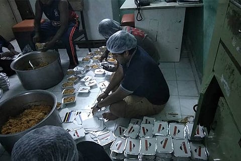 Employees of Kolapasi takeaway packing food  Most