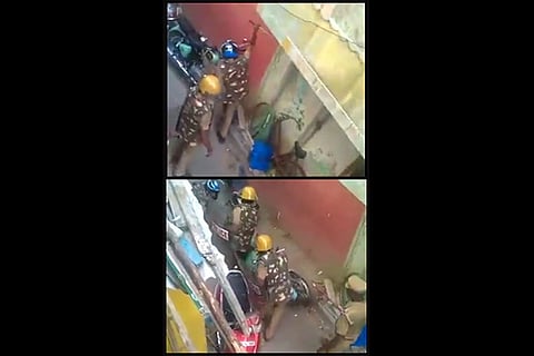 A parked two-wheeler (Top); cops vandalising the vehicle (Below)