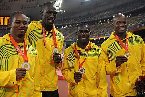 Usain Bolt (second from left) with his Jamaican team-mates at the Beijing Olympics