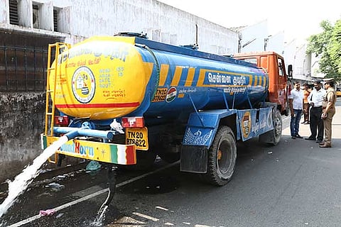 A file photo of officials inspecting a Metro Water tanker