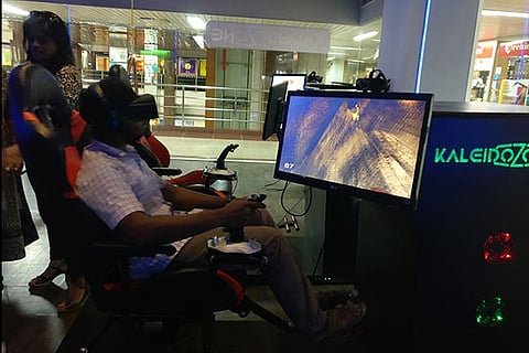 A gamer playing at Interactive Virtual Reality Entertainment Centre