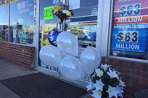 Memorial outside a Lancaster store after the owner was shot and killed (Source: Twitter)