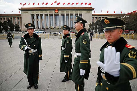 Policemen guard the Great Hall of the People