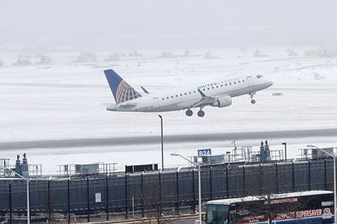 An United Express plane departs during the snowstorm at O'Hare International Airport in Chicago