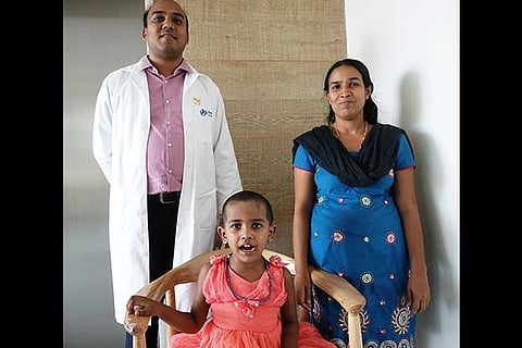 Liya with her mother and the doctor who treated her