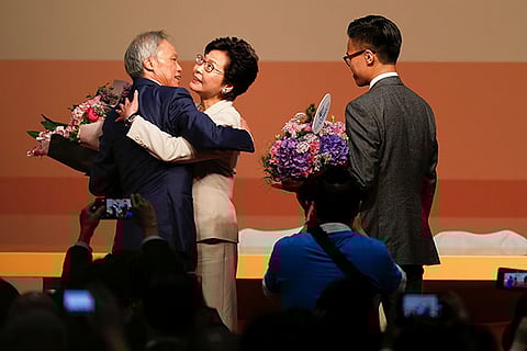 Carrie Lam being congratulated by her husband