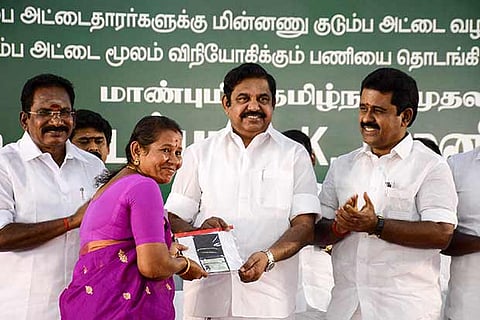 CM Edappadi K Palanisamy distributing SMART ration card to a beneficiary at Korattur