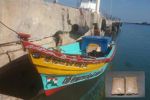 The boat used for smuggling (inset) heroin