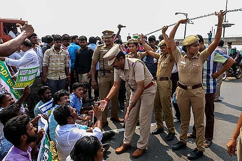 Police speaking to agitators at Kathipara junction on Thursday