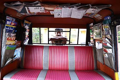 The interior of Annadurai?s autorickshaw stacked with newspapers and magazines