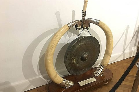 An antique gong framed with ivory