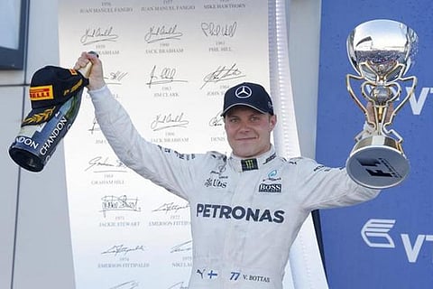 Mercedes F1 driver Valtteri Bottas celebrates the victory on the podium