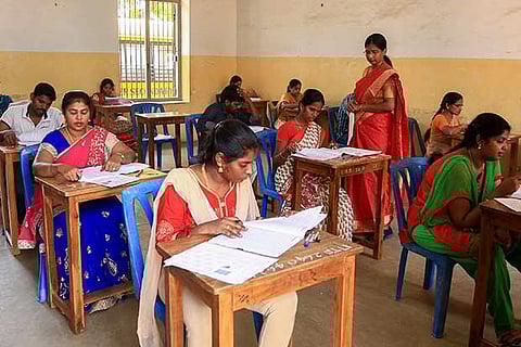 Teachers writing the TET