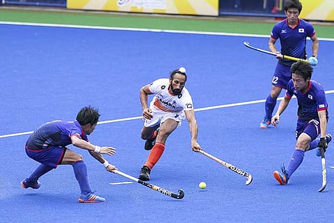 India's Sardar Singh, keeps the ball during their match at the Sultan Azlan Shah Cup