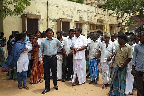 Madurai Collector, K Veera Raghav Rao, inspecting a lightning hit village