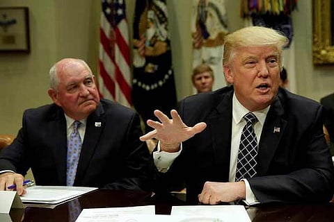 Donald Trump talks to the media