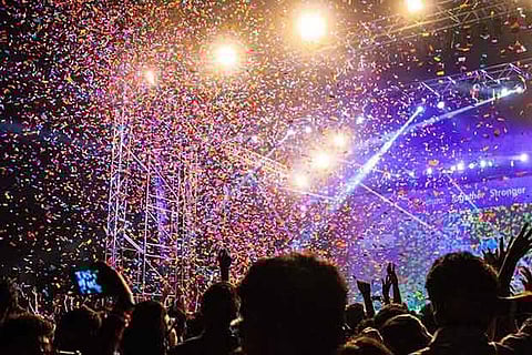Confetti being dispersed into the audience during a rock show at Saarang organised in IIT-Madras