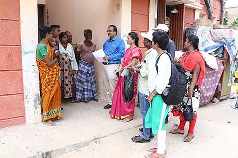 Health officials conduct a tuberculosis screening camp at Tsunami Quarters