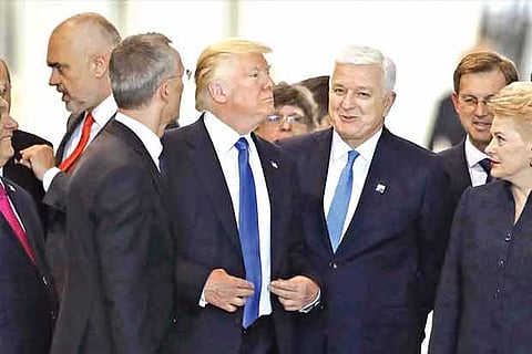Trump shoves NATO member in viral clip