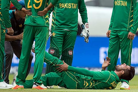 Pakistan paceman Mohammad Amir is being attended to after suffering cramps at Edgbaston