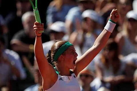 Unseeded Ostapenko stuns Halep to win French Open title