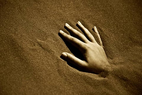 Representative Image of a person buried alive