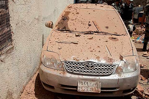 Photo released by Saudi Press Agency, SPA, shows the scene of a suicide bombing after a police raid