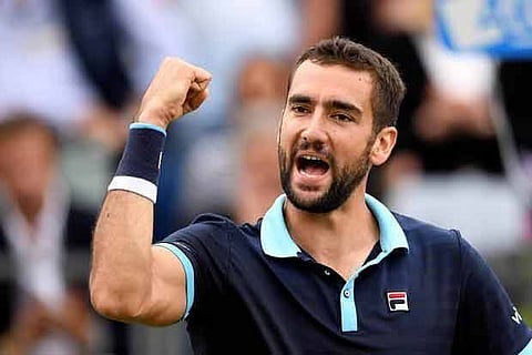 Croatia's Marin Cilic celebrates after winning his match against Luxembourg's Gilles Muller